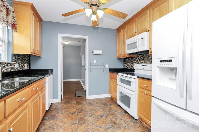 kitchen featuring ceiling fan, white appliances, sink, and tasteful backsplash