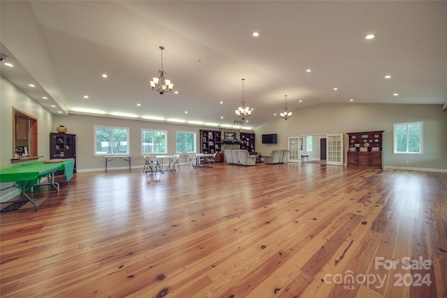 living room featuring light hardwood / wood-style floors and vaulted ceiling