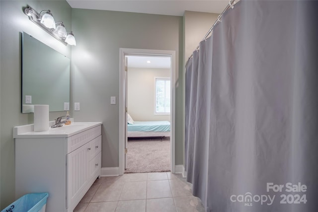 bathroom with tile patterned floors and vanity