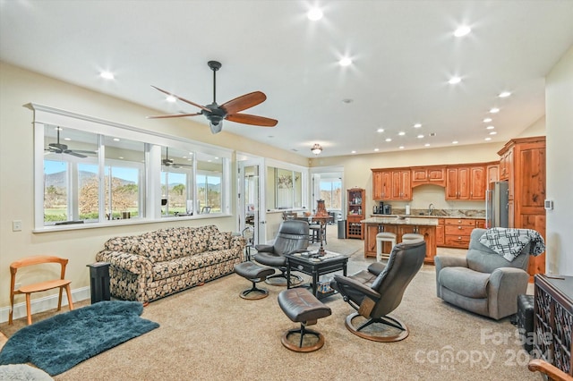 carpeted living room featuring sink