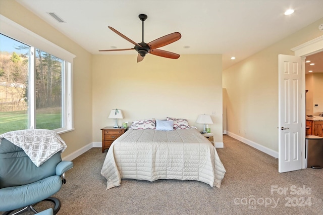 carpeted bedroom with ceiling fan