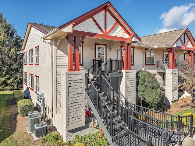 view of front of house featuring a porch and cooling unit