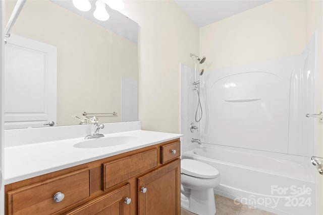 full bathroom featuring tile patterned floors, vanity, toilet, and shower / tub combination