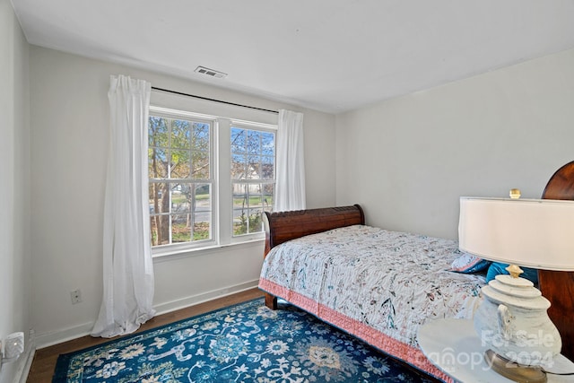 bedroom with hardwood / wood-style flooring