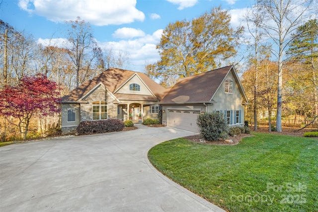 view of front of property featuring a garage and a front lawn