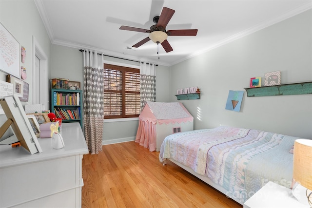 bedroom featuring light hardwood / wood-style flooring, ornamental molding, and ceiling fan