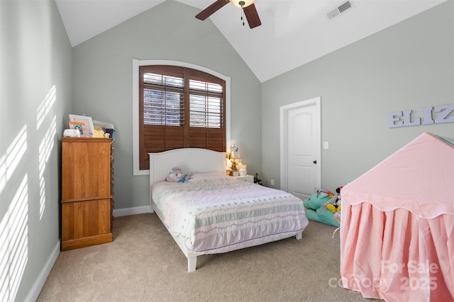 bedroom featuring vaulted ceiling, light colored carpet, and ceiling fan