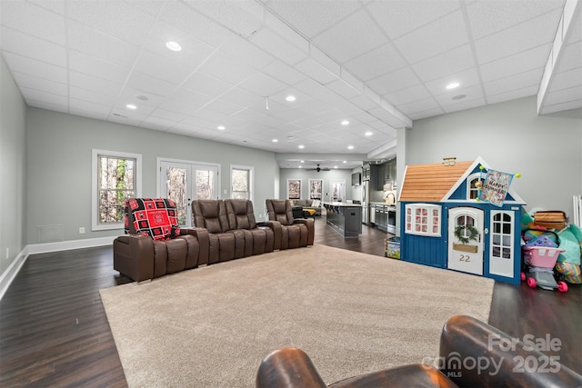 interior space featuring dark hardwood / wood-style flooring, a paneled ceiling, and french doors