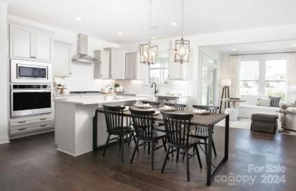 dining space featuring dark hardwood / wood-style floors and sink