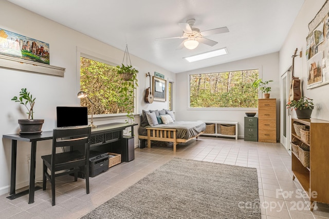 bedroom featuring light tile patterned floors, vaulted ceiling, and ceiling fan