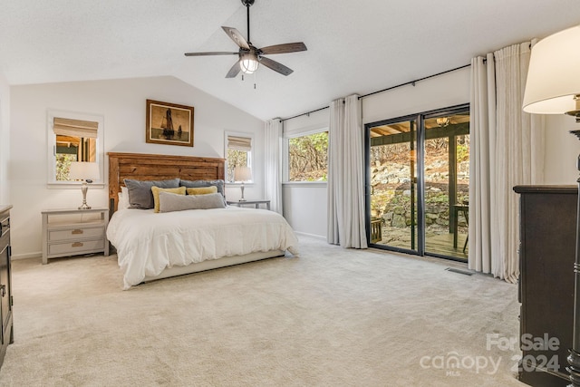 carpeted bedroom featuring ceiling fan, lofted ceiling, and access to outside