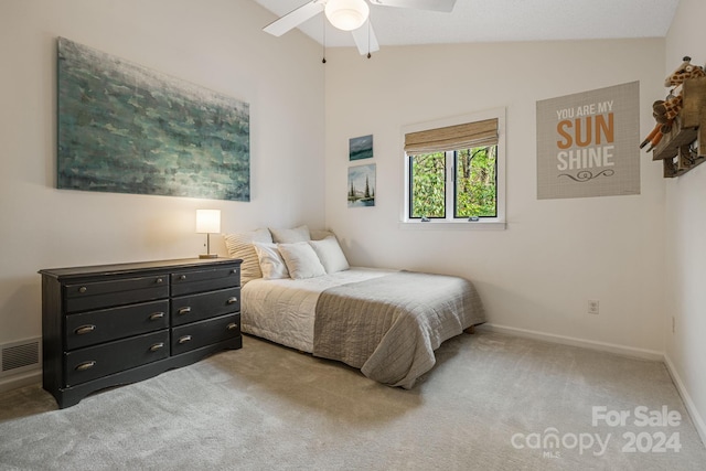 carpeted bedroom featuring ceiling fan and lofted ceiling