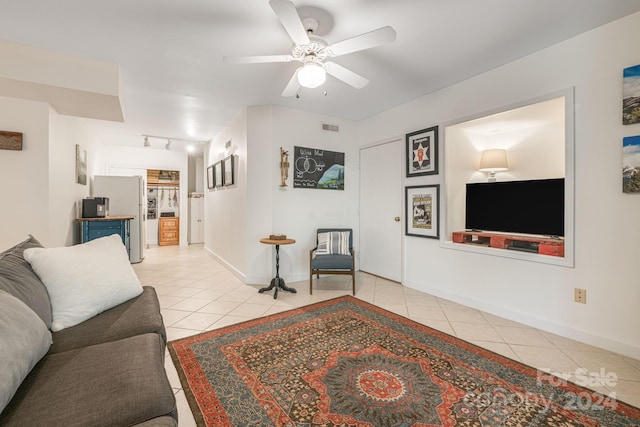 living room with ceiling fan, light tile patterned floors, and track lighting