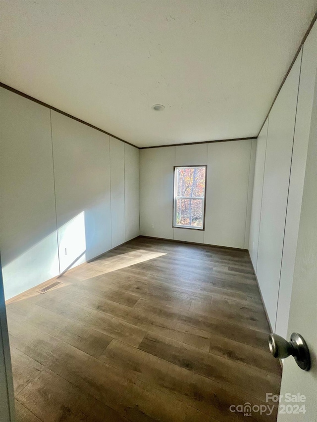 spare room featuring hardwood / wood-style floors