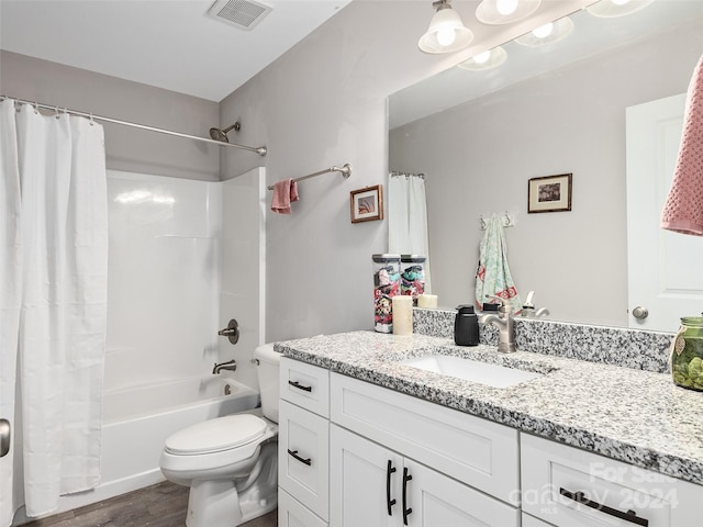 full bathroom featuring shower / tub combo with curtain, vanity, wood-type flooring, and toilet