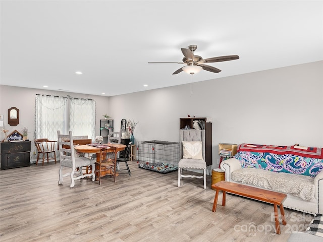 interior space with a ceiling fan, recessed lighting, and wood finished floors