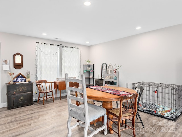 dining area with visible vents, recessed lighting, baseboards, and wood finished floors