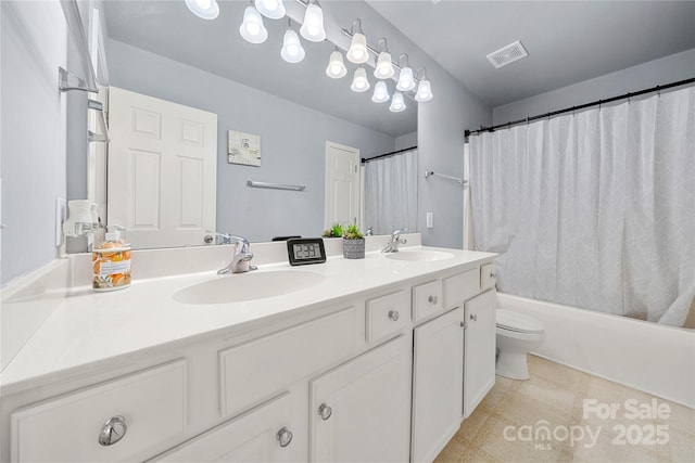 full bathroom featuring toilet, vanity, tile patterned floors, and shower / tub combo with curtain