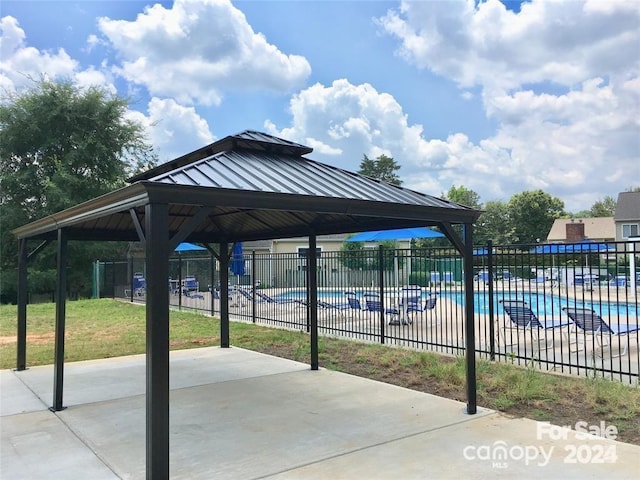 exterior space featuring a patio and a swimming pool