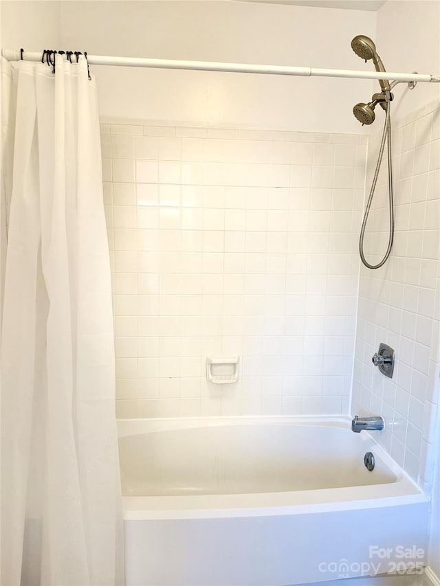 bathroom featuring shower / tub combo with curtain