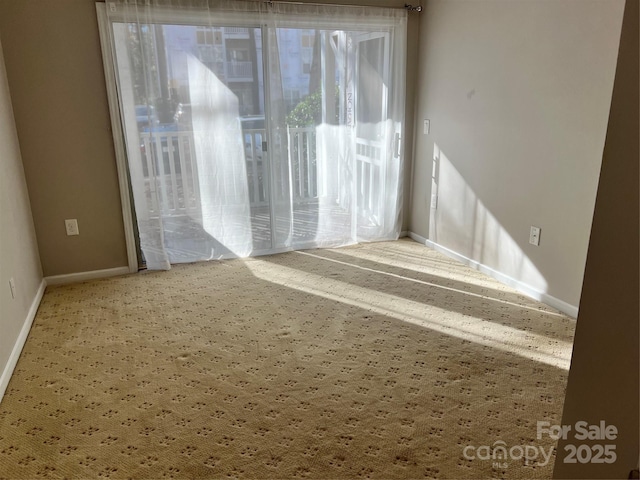 empty room featuring baseboards