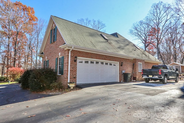 view of side of home featuring a garage