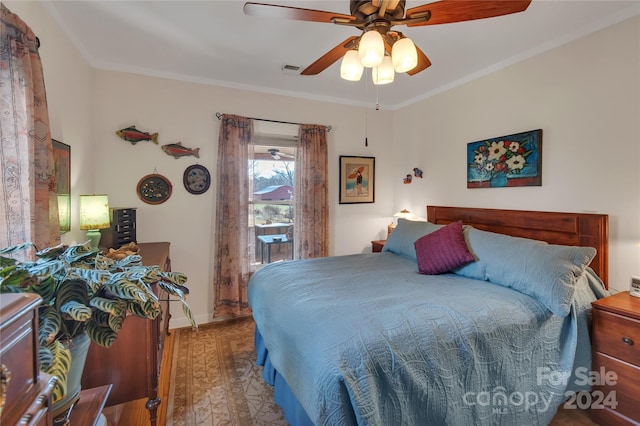 bedroom with wood-type flooring, ceiling fan, and crown molding