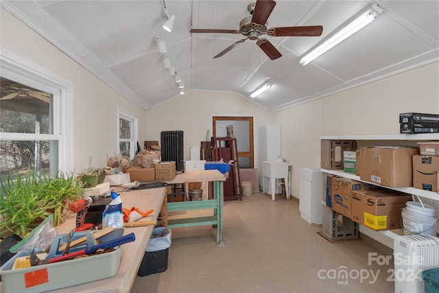 interior space featuring ceiling fan and sink