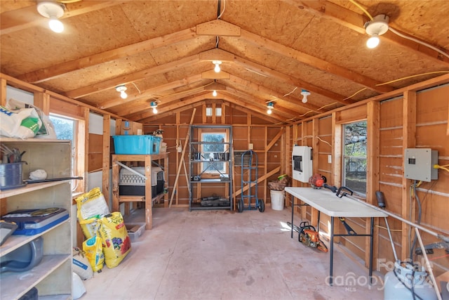 storage room featuring electric panel and heating unit