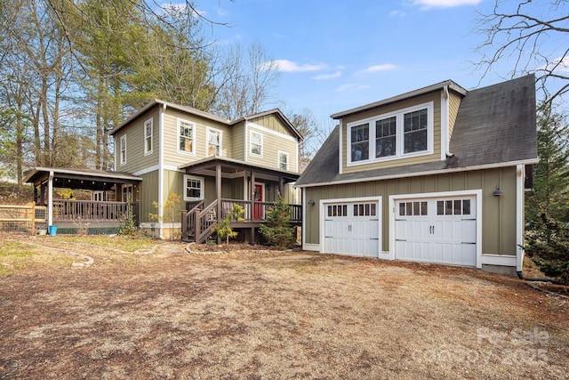 view of front of home featuring a porch and a garage