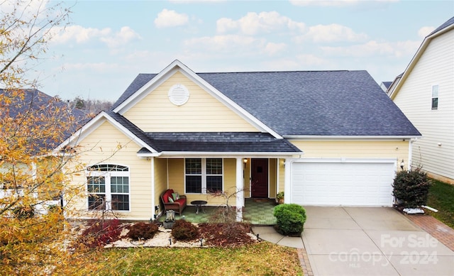 view of front of property featuring a garage and covered porch