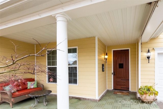 property entrance featuring a porch