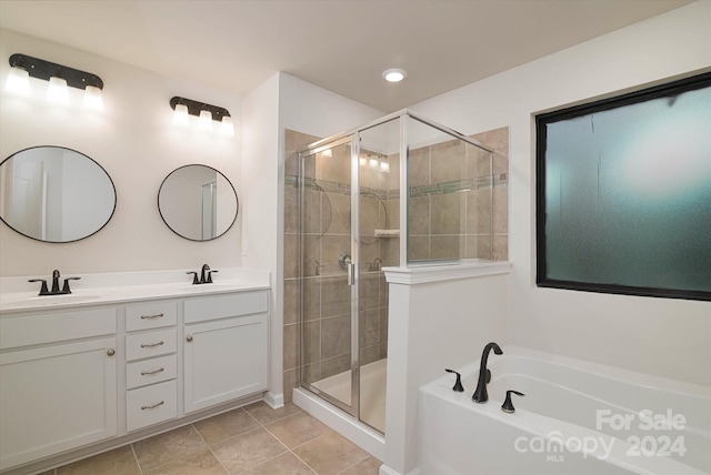 bathroom featuring separate shower and tub, tile patterned flooring, and vanity