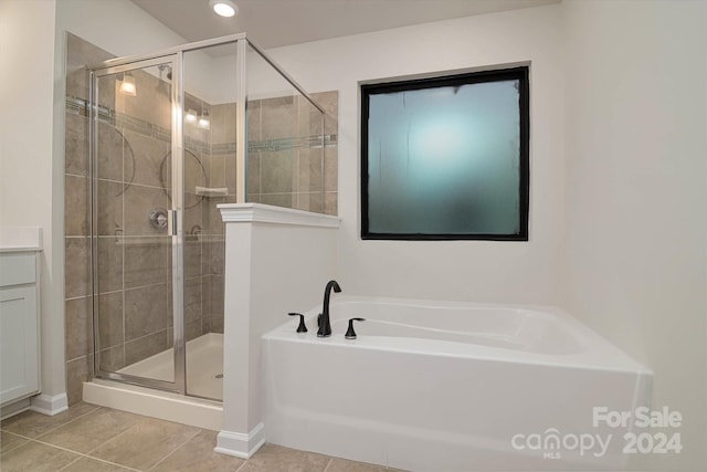 bathroom with tile patterned floors and plus walk in shower