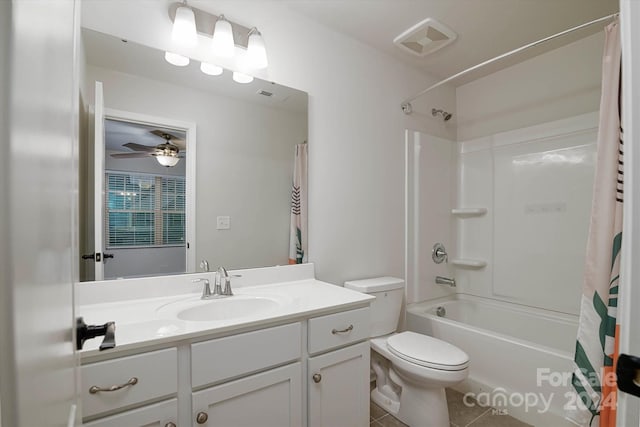 full bathroom featuring ceiling fan, tile patterned floors, toilet, shower / tub combo with curtain, and vanity