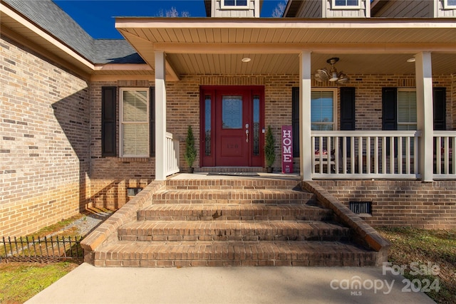 view of exterior entry with covered porch