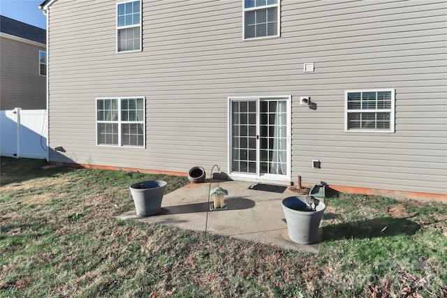 rear view of property featuring a patio area