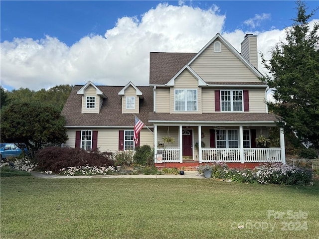 view of front of home featuring a porch and a front yard