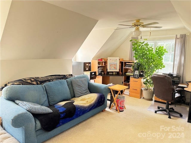 carpeted office with ceiling fan and vaulted ceiling