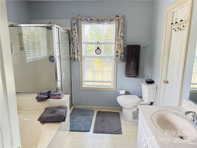 full bathroom featuring tile patterned floors, vanity, independent shower and bath, and toilet