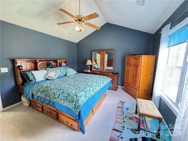 carpeted bedroom featuring ceiling fan and vaulted ceiling