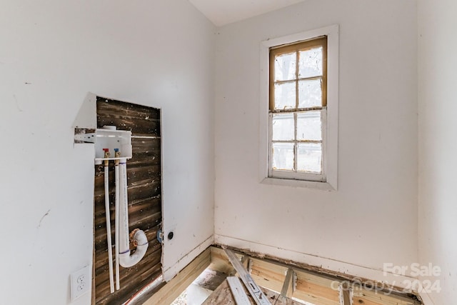 unfurnished room featuring plenty of natural light