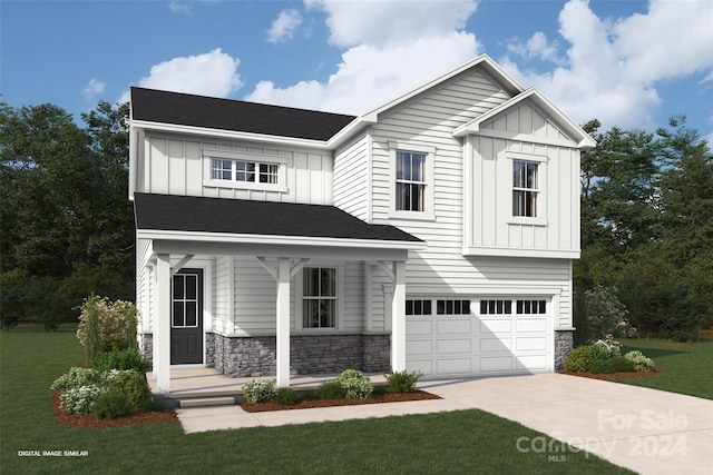 view of front of home with a garage and a front lawn