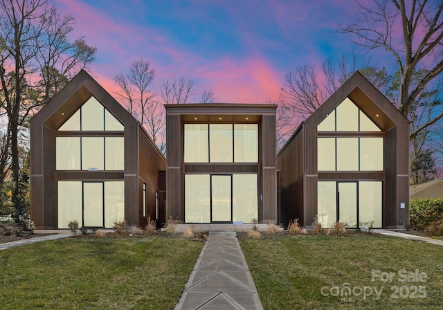 view of front of house with a lawn