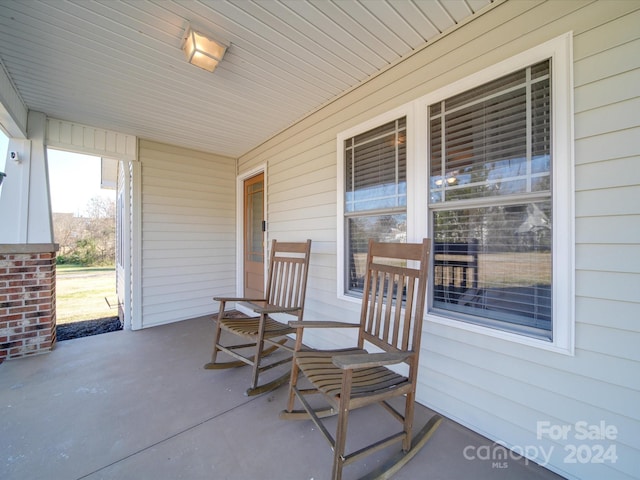 view of patio featuring a porch