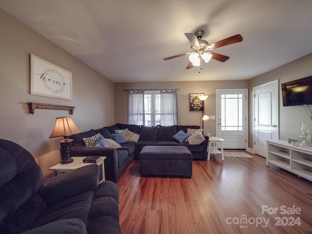 living room featuring hardwood / wood-style floors, plenty of natural light, and ceiling fan