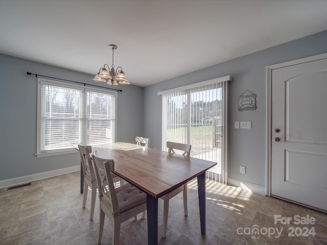 dining area with a notable chandelier