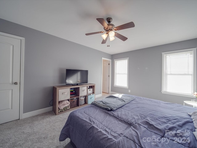 carpeted bedroom featuring ceiling fan