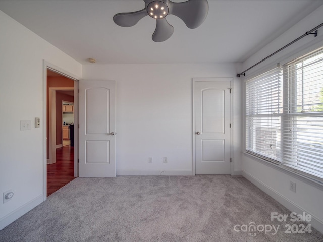 interior space featuring ceiling fan