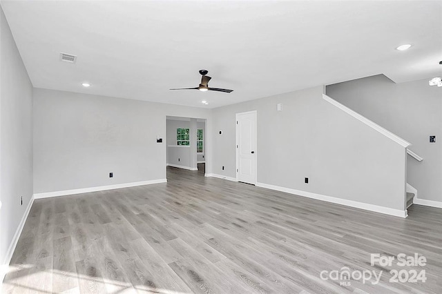 unfurnished living room with light hardwood / wood-style floors and ceiling fan